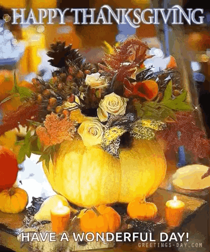 Pumpkin Filled With Flowers And Candles Happy Thanksgiving GIF