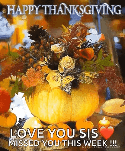 Pumpkin Filled With Flowers and Candles With Happy Thanksgiving Message