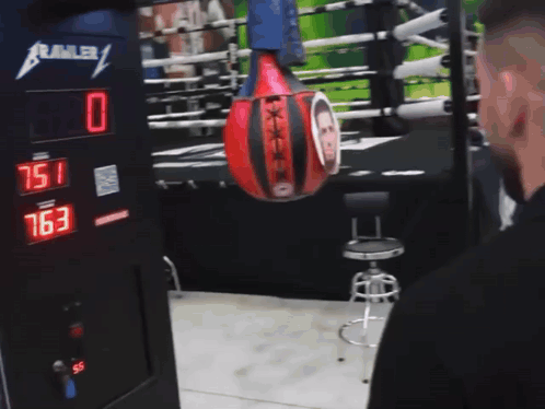 Punching Bag with Man Hanging from Crawler