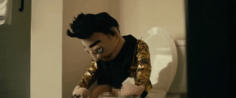 Puppet Boy Sitting In Toilet GIF