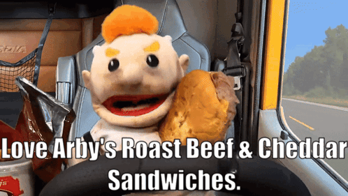 Puppet Holding Roast Beef and Cheddar Sandwich in Truck