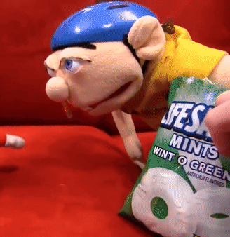 Puppet in Blue Helmet Holding Lifesaver Mints