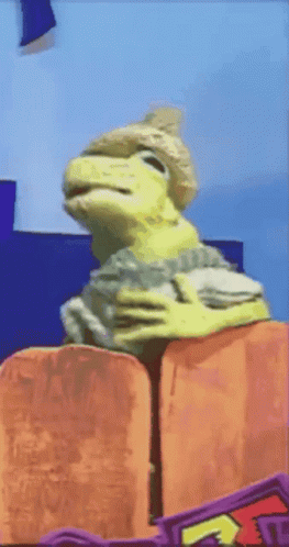 Puppet Lizard With A Hat Dancing GIF