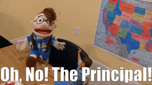 Puppet Sitting At Desk With Uh No Principal GIF