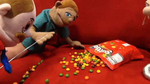 Puppet Smocking On Skittles Candy GIF