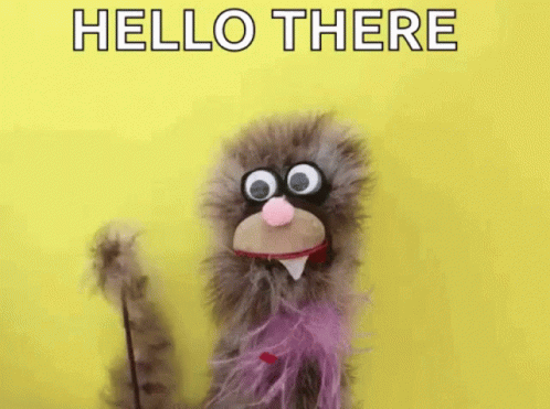 Puppet with Big Eyes and Pink Bow Tie Waving Hello There