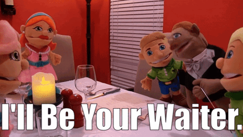 Puppets Sitting at Table Saying Ill Be Your Waiter