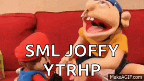 Puppets Sitting On Red Couch GIF