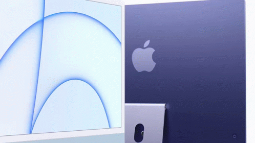 Purple Apple Computer Next to White Computer