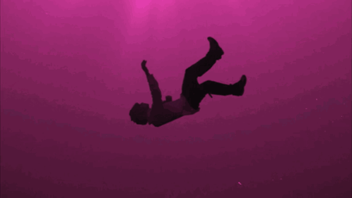 Purple Background Silhouette Falling Into Water GIF