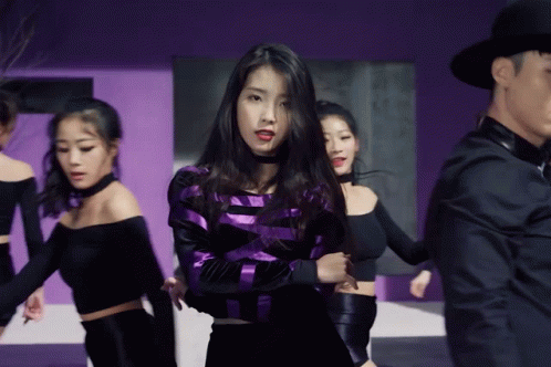 Purple Black Striped Woman Surrounded by Women
