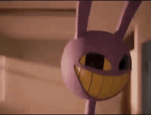 Purple Bunny With Yellow Smile Hanging From Ceiling GIF