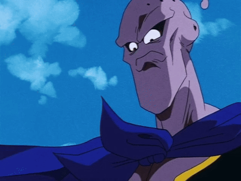 Purple Cartoon Character With Blue Cape