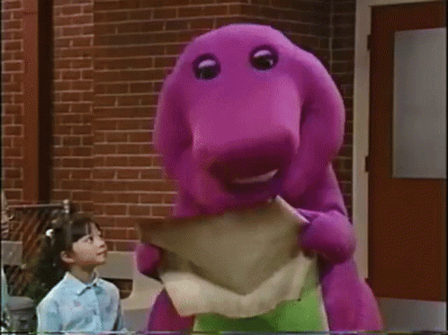 Purple Dinosaur Holding Paper By Brick Building GIF