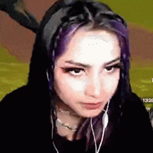 Purple Hair Girl Making Face With Headphones
