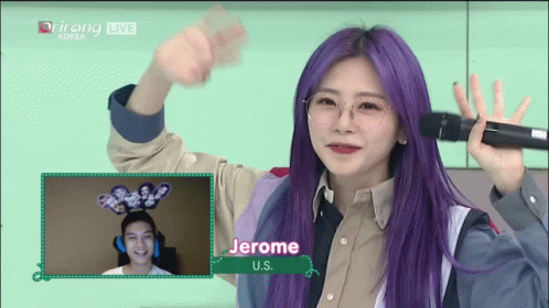 Purple Hair Woman Holding Microphone at Jerome Sign