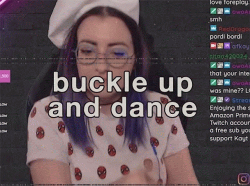 Purple Hair Woman in Spiderman Shirt Buckling Up Dancing