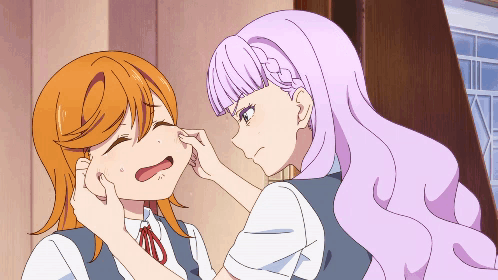 Purple Haired Girl Touching Orange Haired Girl's Face