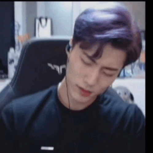Purple Haired Man Sitting In Chair With Headphones GIF