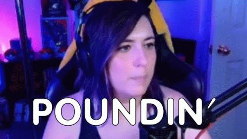 Purple Haired Woman at Microphone Saying Poundin