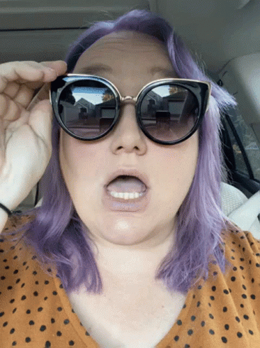 Purple-Haired Woman In Sunglasses With Open Mouth GIF