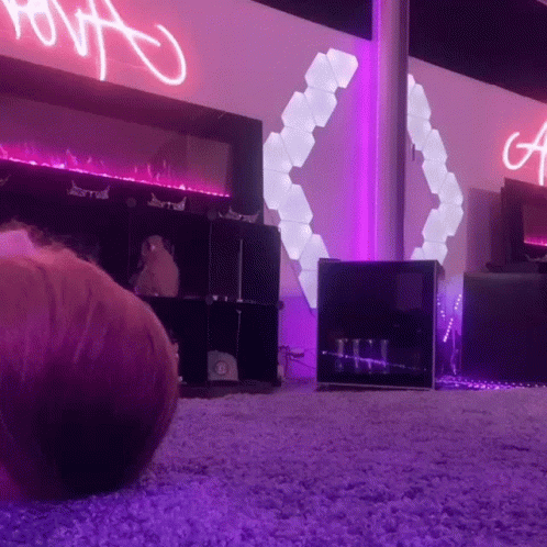 Purple Lit Room With A Sign