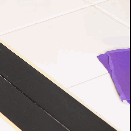 Purple Paper on Tiled Floor