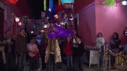 Purple Piñata Thrown By Group GIF