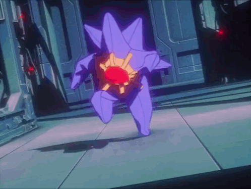 Purple Robot With Red Center Standing in Room