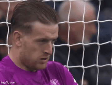 Purple Shirt Soccer Player Looking at Net