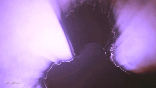 Purple Smoke Is Coming Out Of A Hole In A Wall GIF