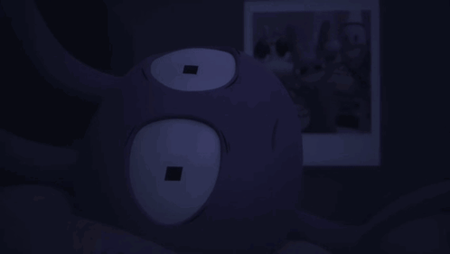 Purple Stuffed Animal With Square in Eyes