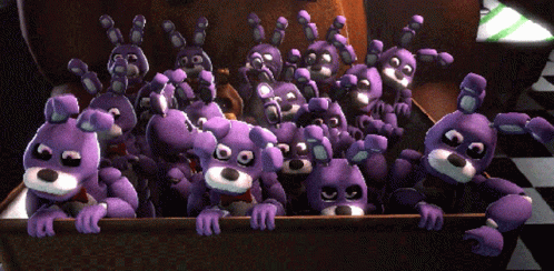 Purple Stuffed Animals Peeking Out of Wooden Box