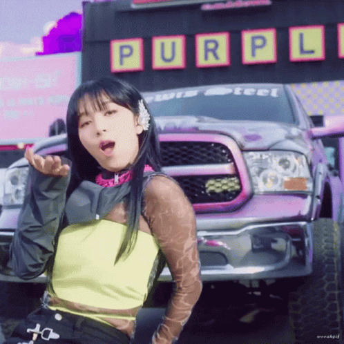 Purple Truck Parked In Front Of Purple Sign GIF