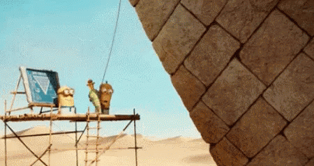 Pyramid Being Built in Desert With Ladder
