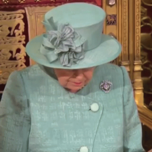 Queen Elizabeth Wearing A Blue Hat And A Blue Coat GIF