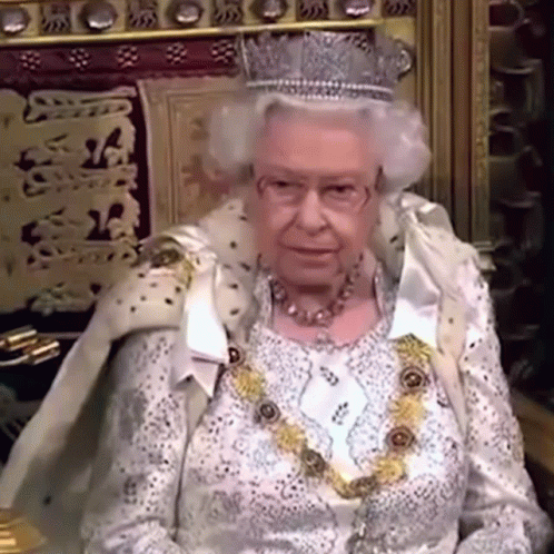 Queen Elizabeth Wearing Crown and Necklace on Throne