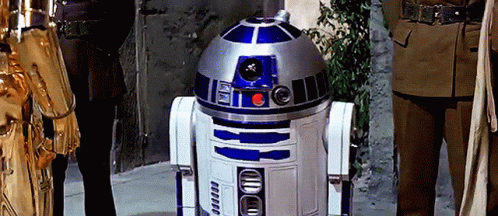 R2D2 Robot Next to Man Statue