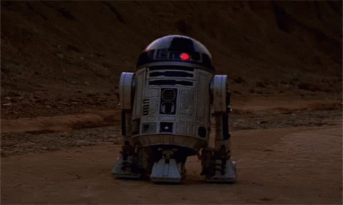 R2D2 Standing on Dirt Field
