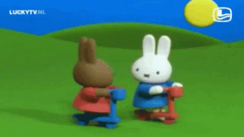 Rabbits Standing Next to Each Other on Scooters