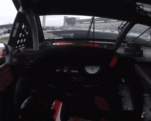 Race Car Dashboard With Red Triangle And Clock GIF