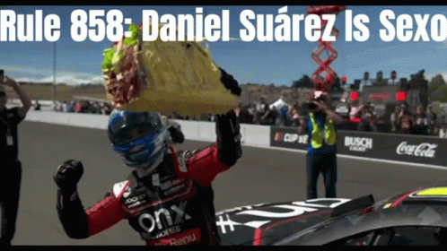 Race Car Driver Holding Bag Over Head Rule 858 Daniel Suarez Is Sexo