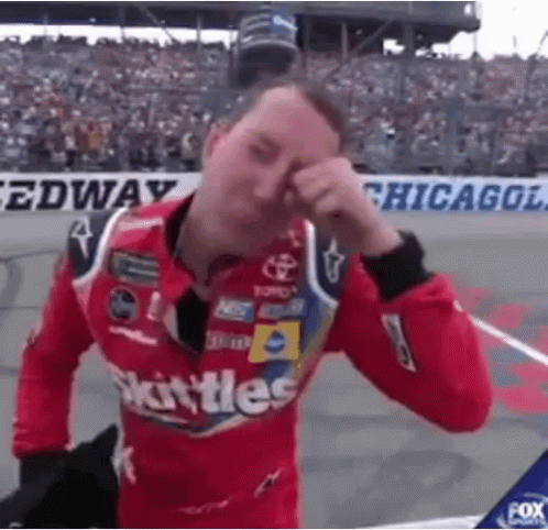 Race Car Driver Holding Checkered Flag by Lucas Car