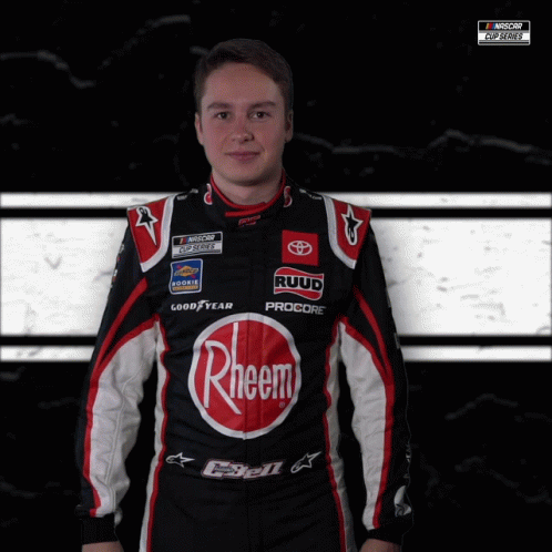Race Car Driver in Black and Red Rheem Outfit