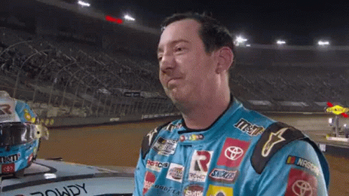 Race Car Driver in Blue Shirt With M&M's and Snickers