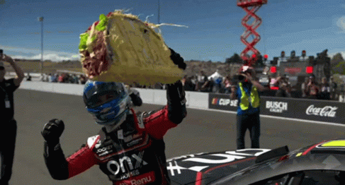 Race Car Driver Taco Over Head Coca Cola Banner