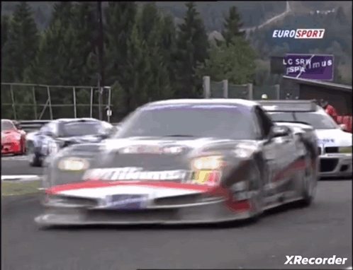 Race Car Driving Down Track Says Eurosport