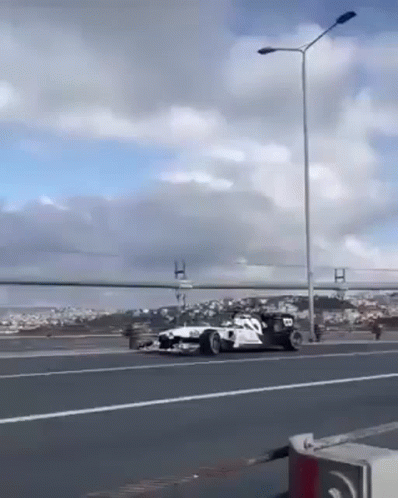 Race Car Driving on Highway