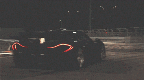 Race Car Driving Past Fence Saying Pennsylvania