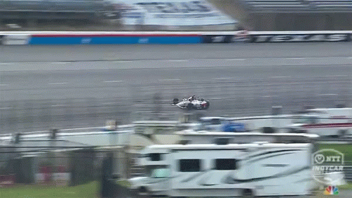 Race Car Flying Over RV IndyCar
